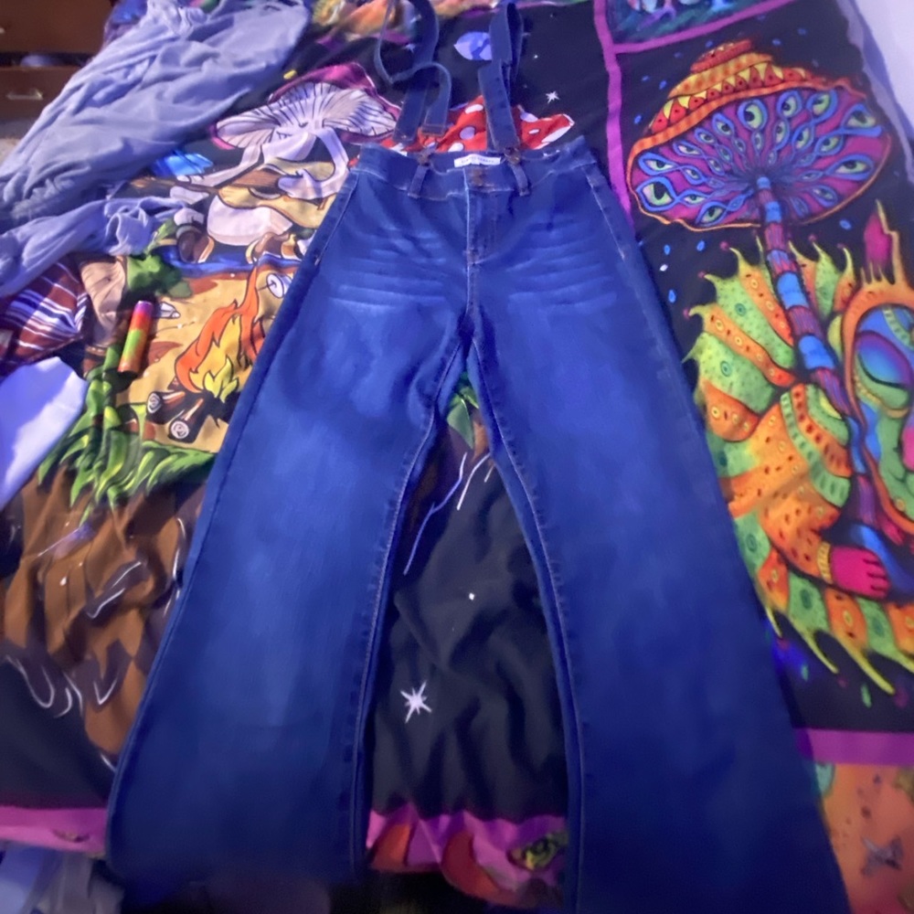 High rise jeans with suspenders.